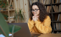 Female student studying at home. 