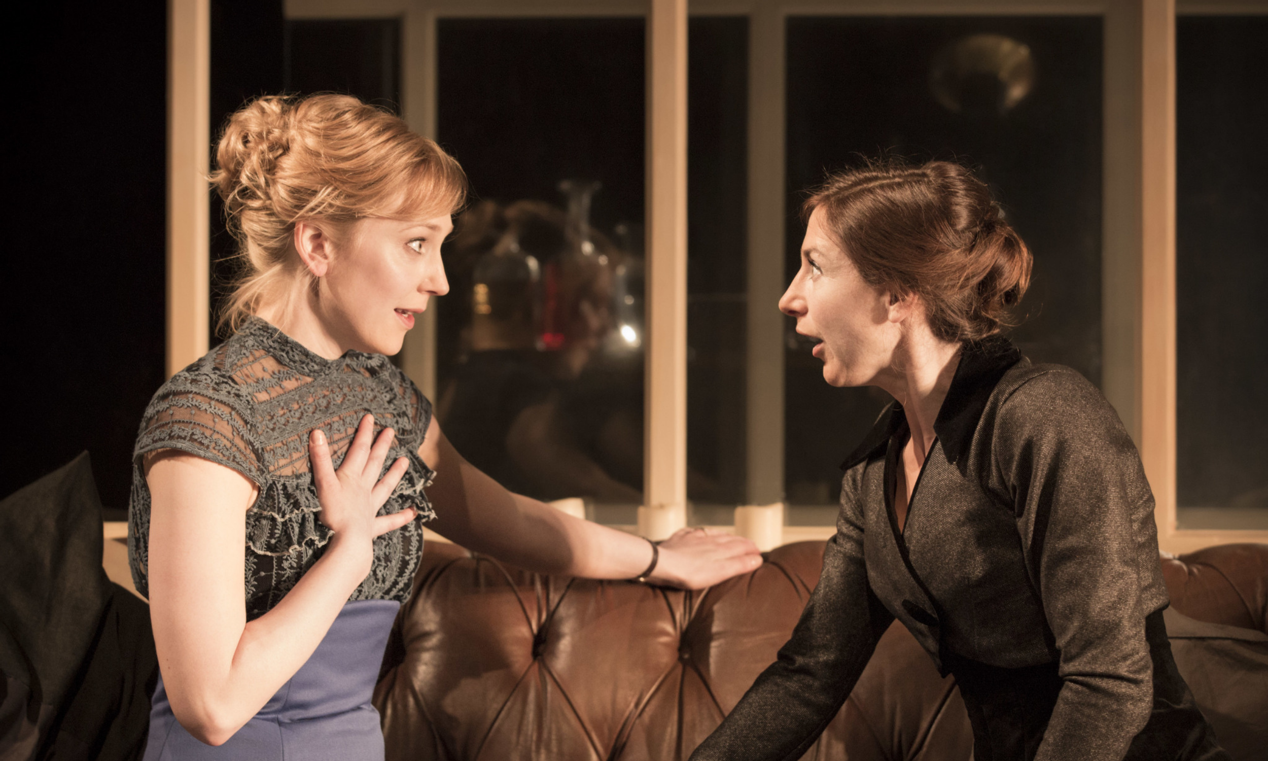  Hattie Morahan (Nora) and Susannah Wise (Kristine Linde) look at each other in shock in the Young Vic's A Doll's House © Johan Persson
