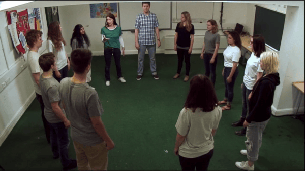 Students standing in a circle