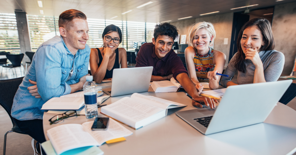 University aged students studying in a library 