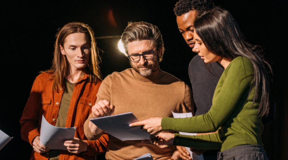 Image of students discussing a script