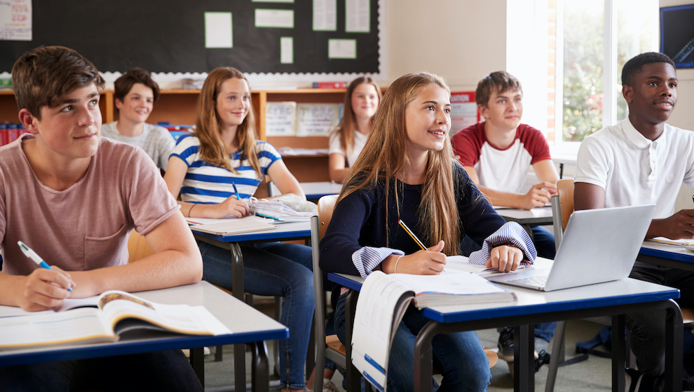 Students sitting at desks in a classroom